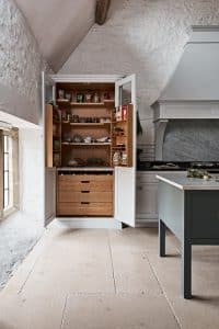 cottage kitchen with a white pantry cabinet