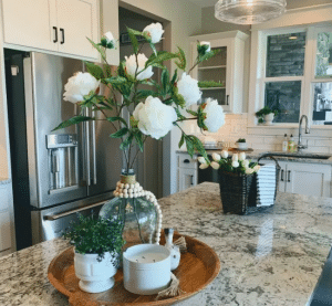 Decorating kitchen with some flowers and pots